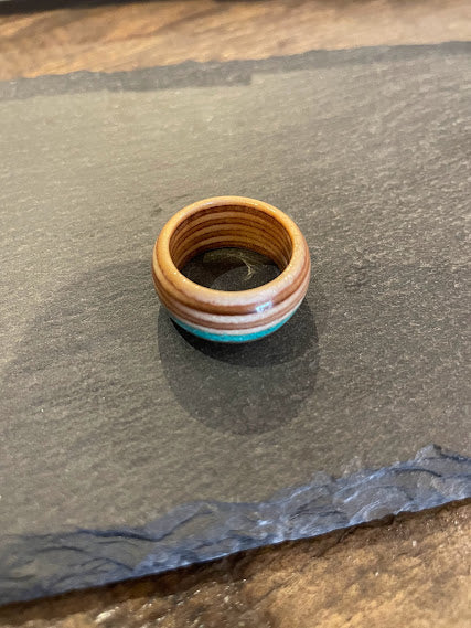 Round wooden ring with blue stones